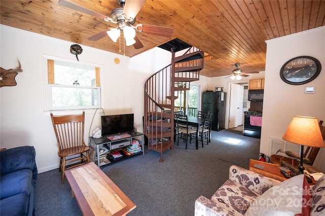 living room featuring dark carpet, ceiling fan, and wooden ceiling