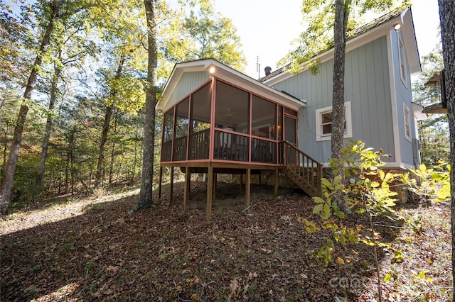 rear view of house with a sunroom