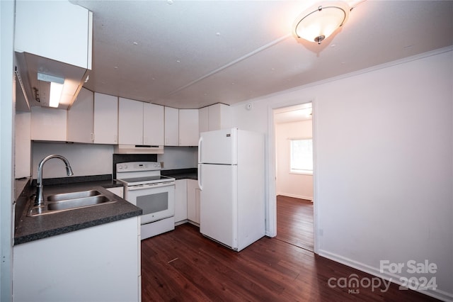 kitchen with white appliances, sink, white cabinets, dark wood-type flooring, and crown molding