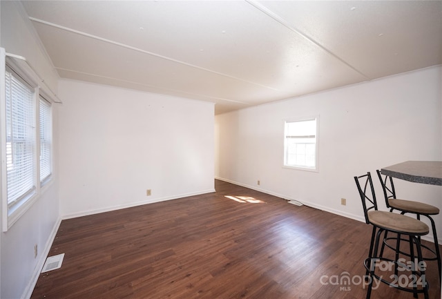 empty room featuring dark hardwood / wood-style floors