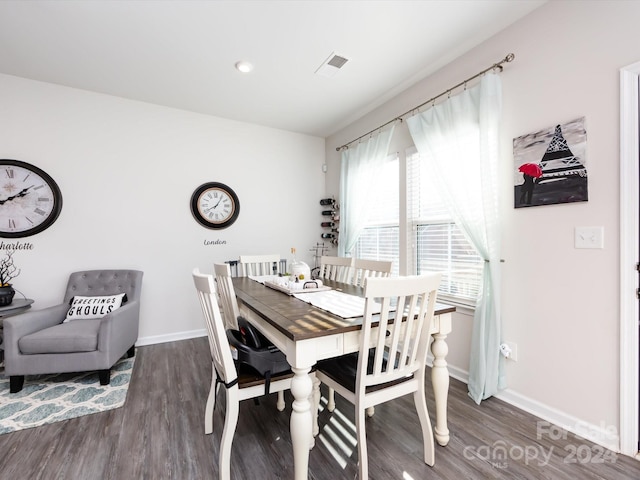 dining area with dark wood-type flooring