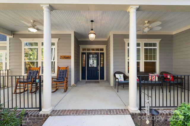 entrance to property featuring covered porch and ceiling fan