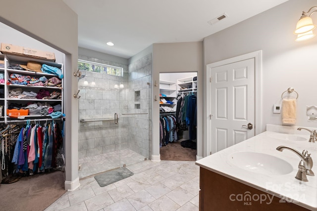 bathroom with vanity, tile patterned floors, and a shower with shower door