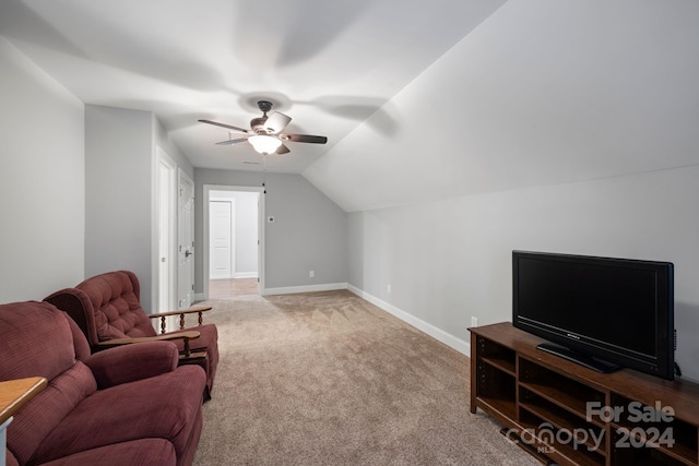 interior space featuring ceiling fan, carpet, and vaulted ceiling