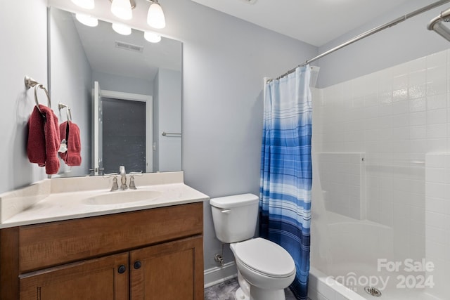 bathroom with vanity, walk in shower, and toilet