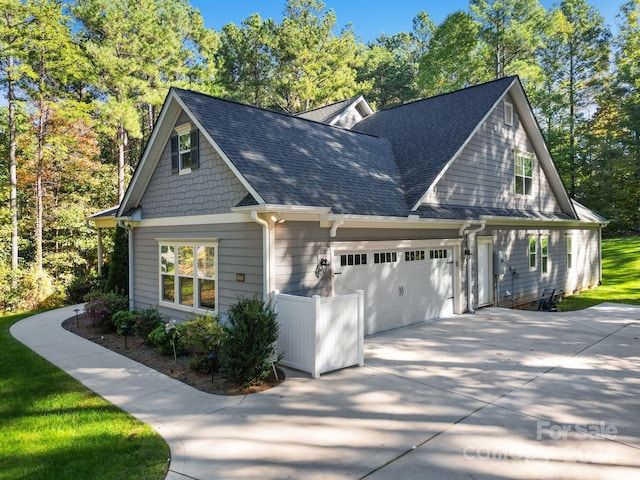 view of side of property with a garage