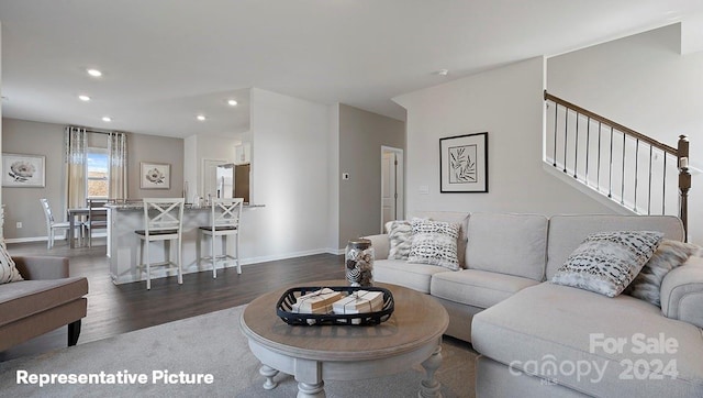 living room with dark hardwood / wood-style floors