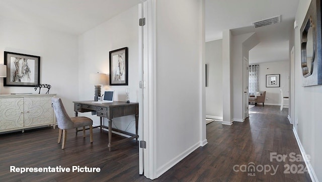 hallway with dark hardwood / wood-style flooring