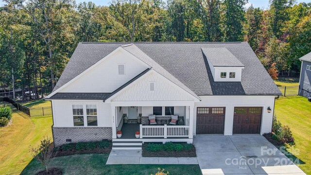 view of front of home with a porch and a front lawn