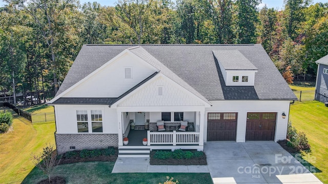 modern farmhouse style home featuring a front yard, brick siding, covered porch, and crawl space