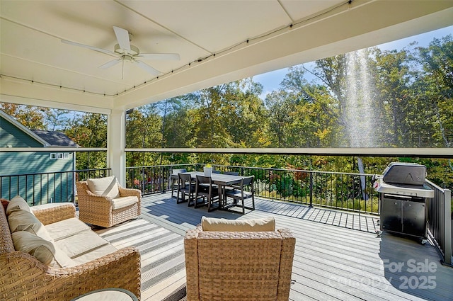 deck with an outdoor hangout area, area for grilling, ceiling fan, and outdoor dining space