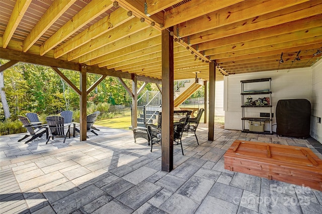 view of patio / terrace featuring stairway and outdoor dining area