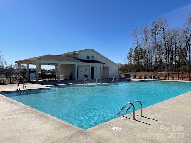 pool featuring a patio and fence