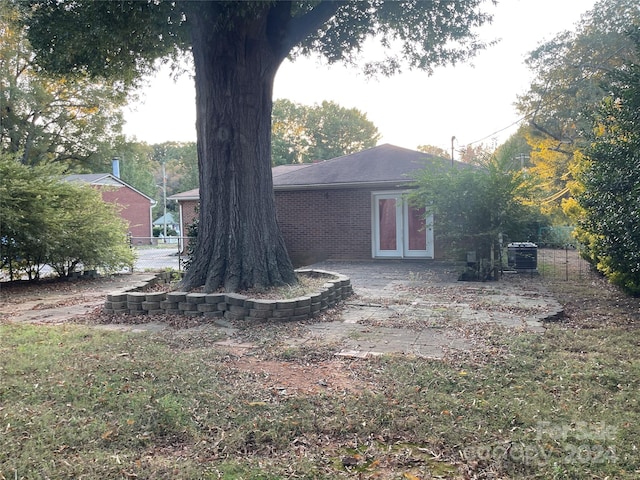 view of yard featuring french doors