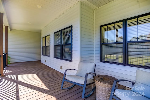 wooden terrace featuring a porch