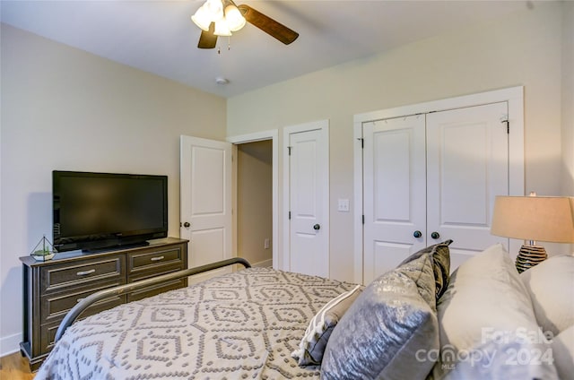 bedroom with ceiling fan and light hardwood / wood-style flooring