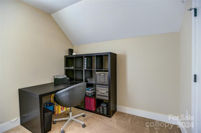 carpeted office with vaulted ceiling