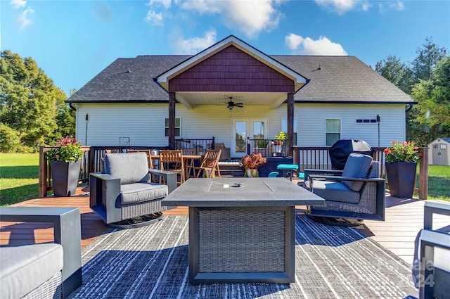 wooden terrace featuring outdoor lounge area, a grill, and ceiling fan