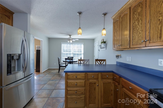 kitchen with a textured ceiling, stainless steel fridge with ice dispenser, pendant lighting, and ceiling fan