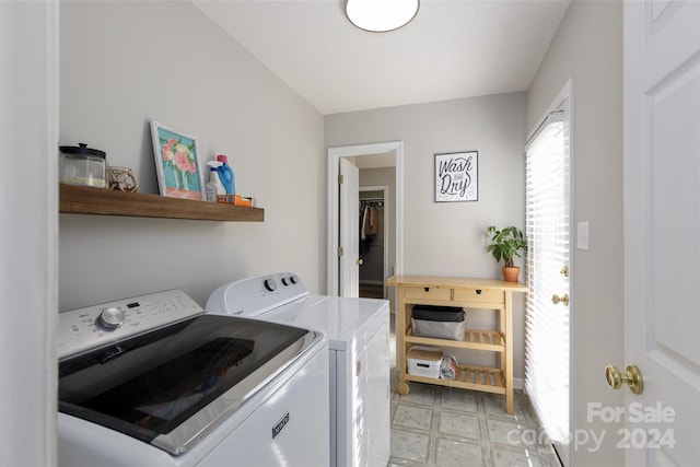 clothes washing area with washer and dryer