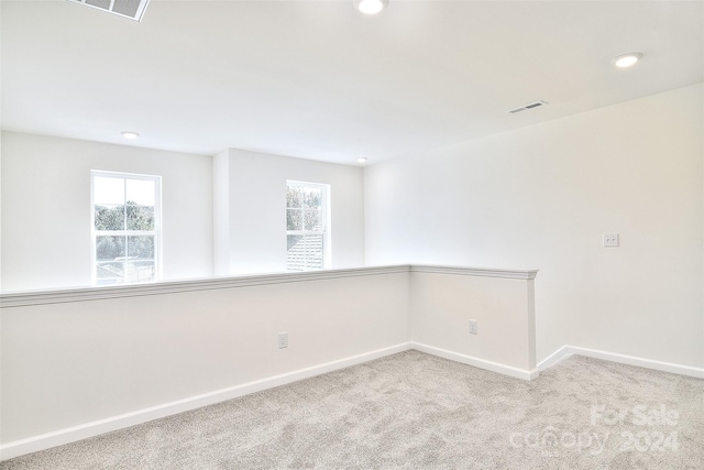 empty room featuring carpet floors