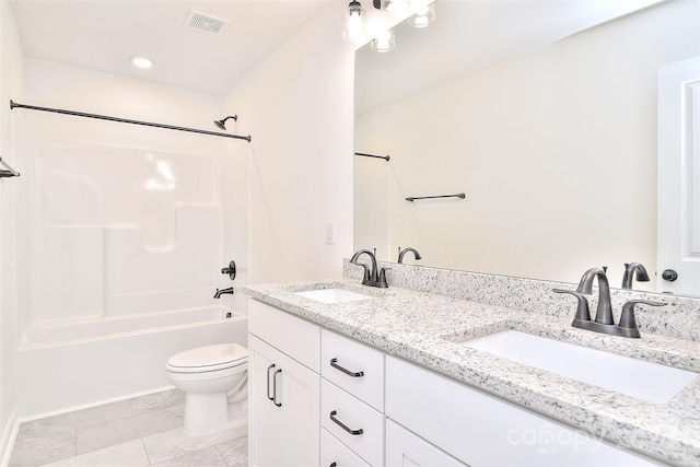 full bathroom featuring vanity, washtub / shower combination, toilet, and tile patterned floors