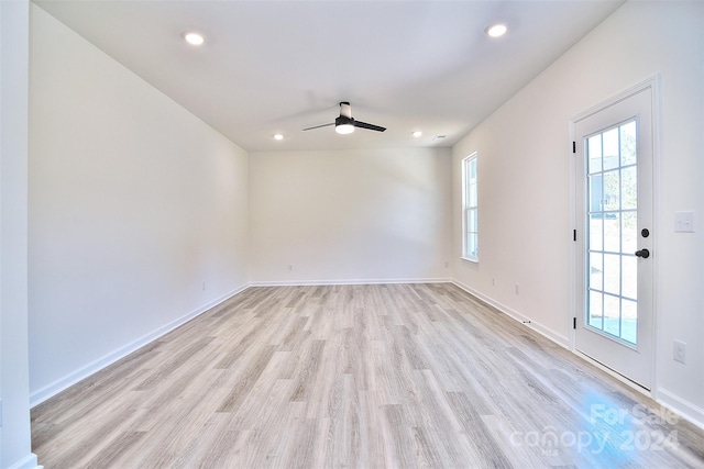 unfurnished room with light hardwood / wood-style floors and ceiling fan