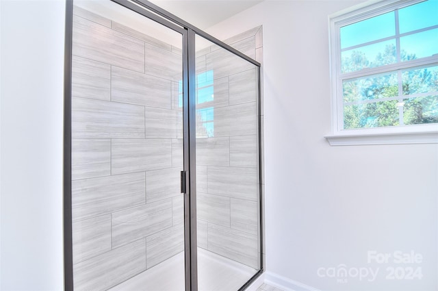 bathroom featuring an enclosed shower