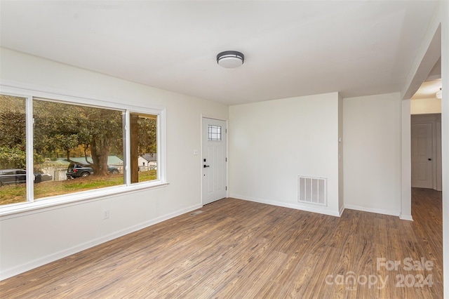 empty room with wood-type flooring