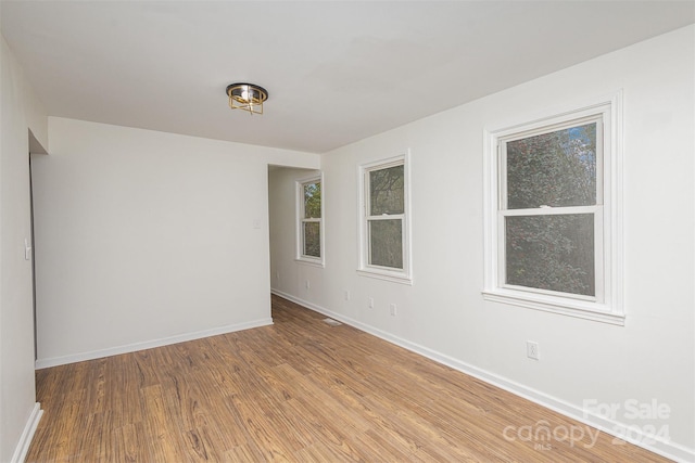 unfurnished room featuring wood-type flooring