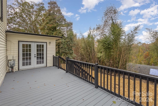 wooden deck featuring french doors