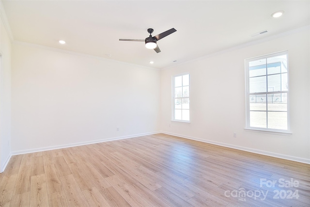 unfurnished room featuring ornamental molding, light hardwood / wood-style floors, and ceiling fan