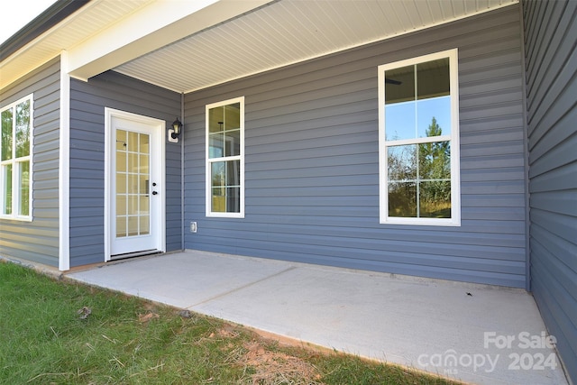 property entrance with a patio