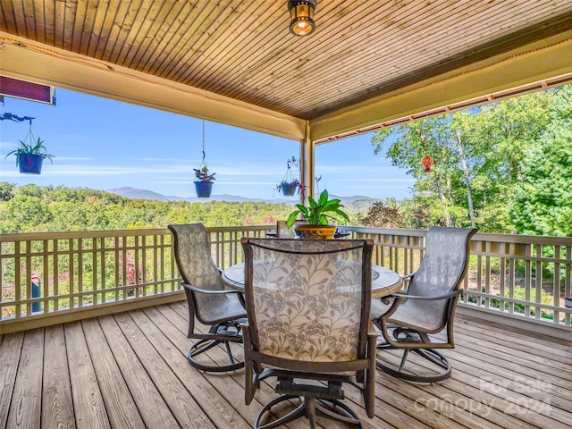 wooden terrace featuring a mountain view