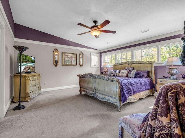 carpeted bedroom with lofted ceiling and ceiling fan