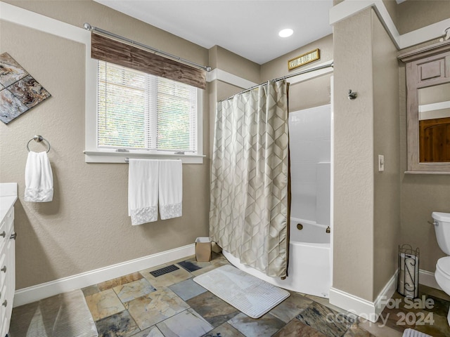 full bathroom featuring vanity, toilet, and shower / bath combo with shower curtain