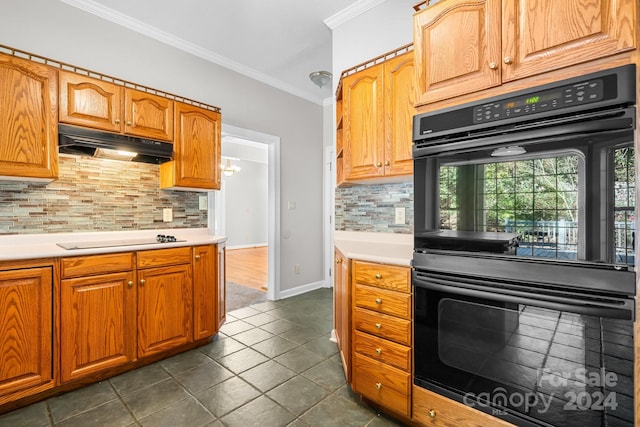 kitchen featuring dark tile patterned floors, backsplash, ornamental molding, electric cooktop, and black double oven