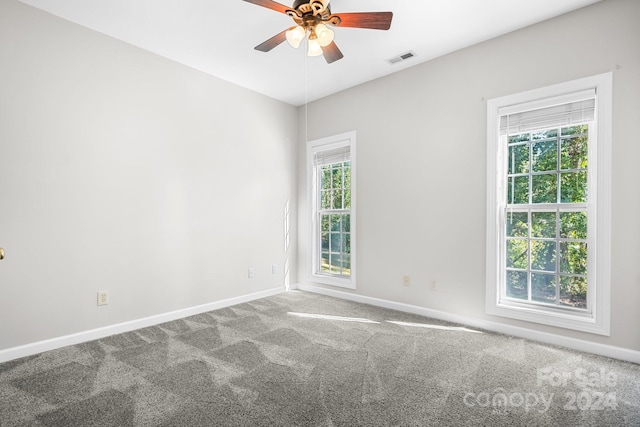 empty room with carpet and ceiling fan