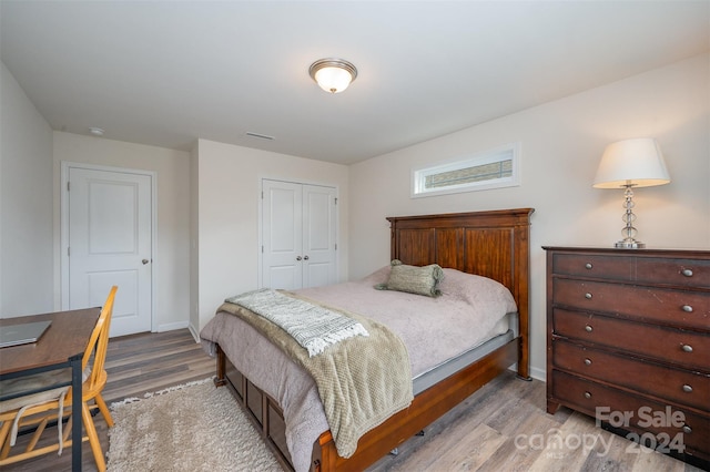 bedroom with a closet and light wood-type flooring