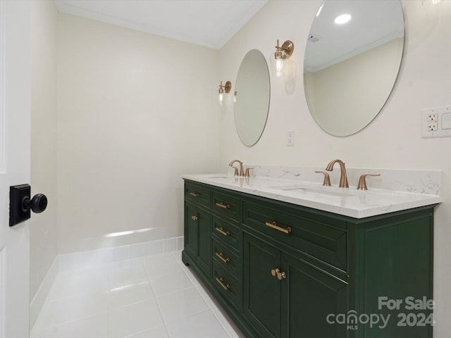 bathroom with vanity, crown molding, and tile patterned flooring