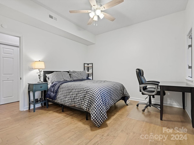 bedroom featuring light hardwood / wood-style flooring and ceiling fan