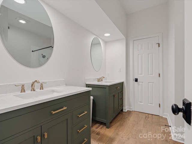 bathroom with vanity and hardwood / wood-style floors