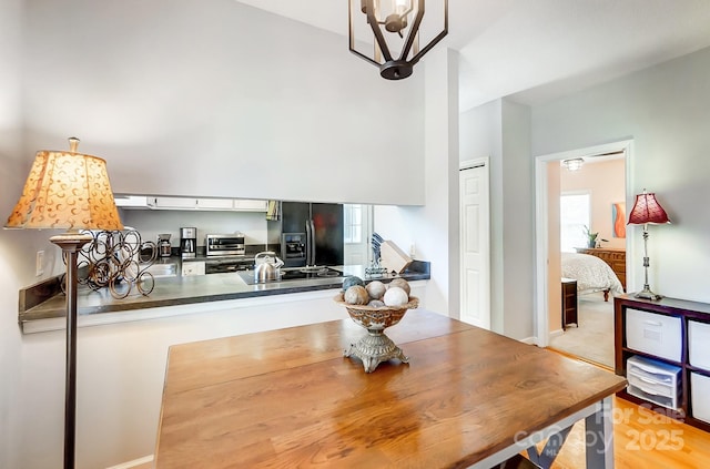 dining room with a chandelier and plenty of natural light