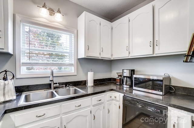 kitchen featuring white cabinetry, dishwasher, a textured ceiling, and sink