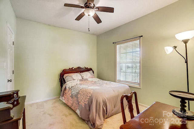 bedroom featuring ceiling fan and light colored carpet