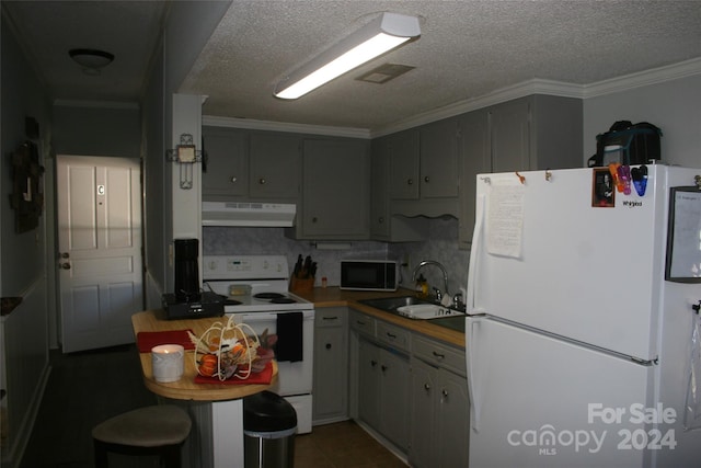 316 N Government St, Lincolnton, NC 28092 - kitchen with ornamental molding, decorative backsplash, sink, and white appliances