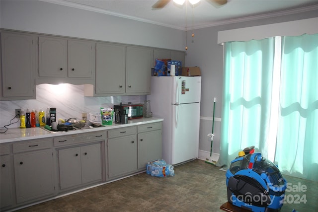316 N Government St, Lincolnton, NC 28092 - kitchen with sink, backsplash, ceiling fan, crown molding, and white refrigerator