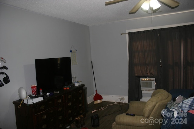 316 N Government St, Lincolnton, NC 28092 - living room featuring ceiling fan, a textured ceiling, and a wall unit AC