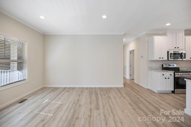 kitchen featuring light stone countertops, appliances with stainless steel finishes, crown molding, light hardwood / wood-style flooring, and white cabinets