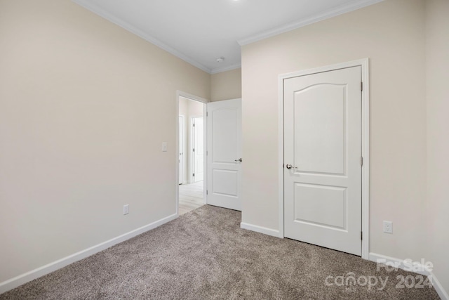 unfurnished bedroom with light carpet and ornamental molding